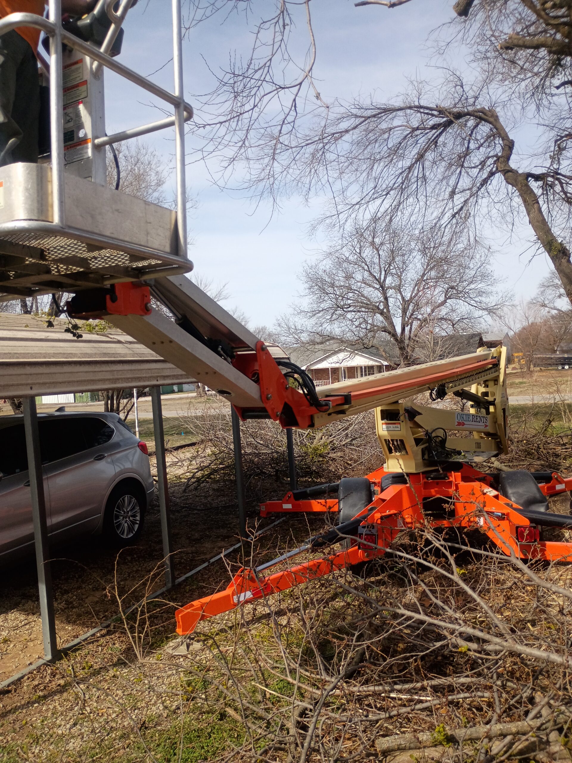 Tree service equipment working among branches
